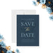 dusty blue floral wedding save the date card with botanical foliage design for romantic garden wedding celebrations-front