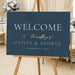 dusty blue wedding welcome sign with botanical foliage design for romantic garden wedding ceremonies and receptions