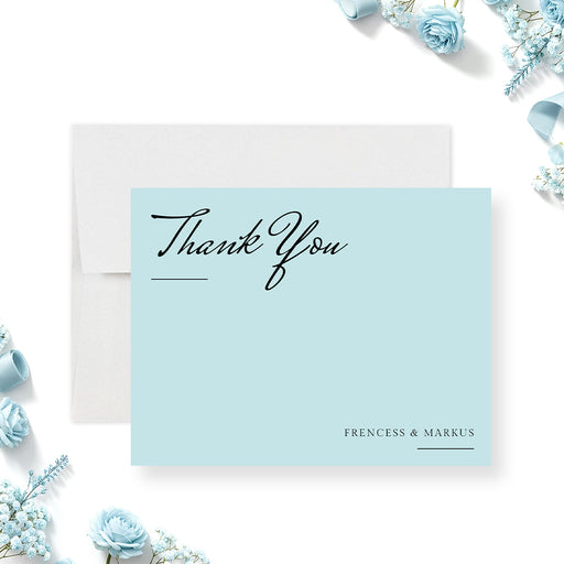 Personalized blue wedding thank you card with elegant script lettering and minimalist design-front