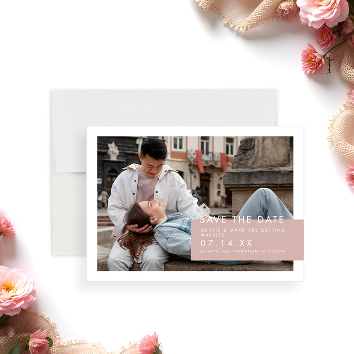 Blush pink wedding save the date card featuring a romantic couple photo-front