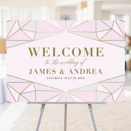 blush pink wedding welcome sign with jewel-inspired geometric frame, refined lettering, and personalized wedding details