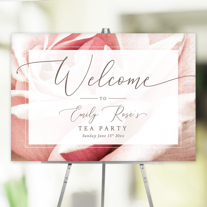 blush rose floral tea party welcome sign with elegant script lettering and personalized event details displayed on an easel