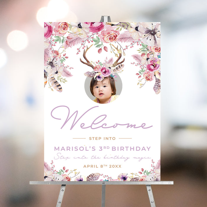 Boho floral welcome sign featuring a child's photo with antlers and a flower crown for birthday party entrance decor.
