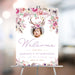 Boho floral welcome sign featuring a child's photo with antlers and a flower crown for birthday party entrance decor.