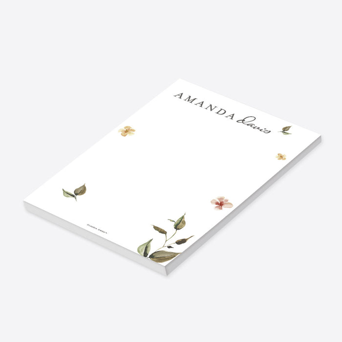 personalized botanical notepad with soft watercolor flowers, greenery, and custom names for a wedding stationery gift-side