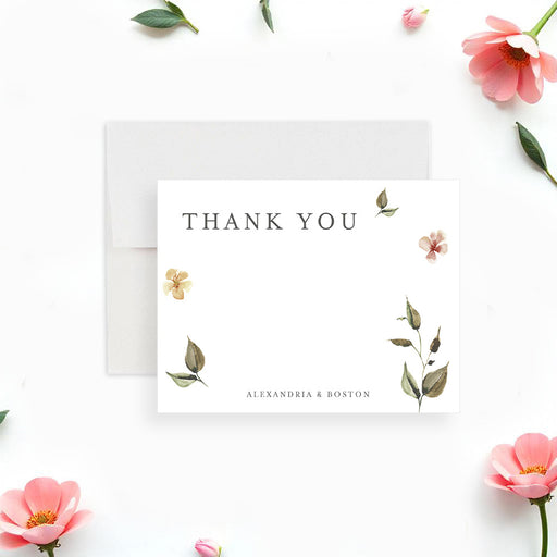 botanical wedding thank you card with soft watercolor flowers, greenery, and personalized couple names-front
