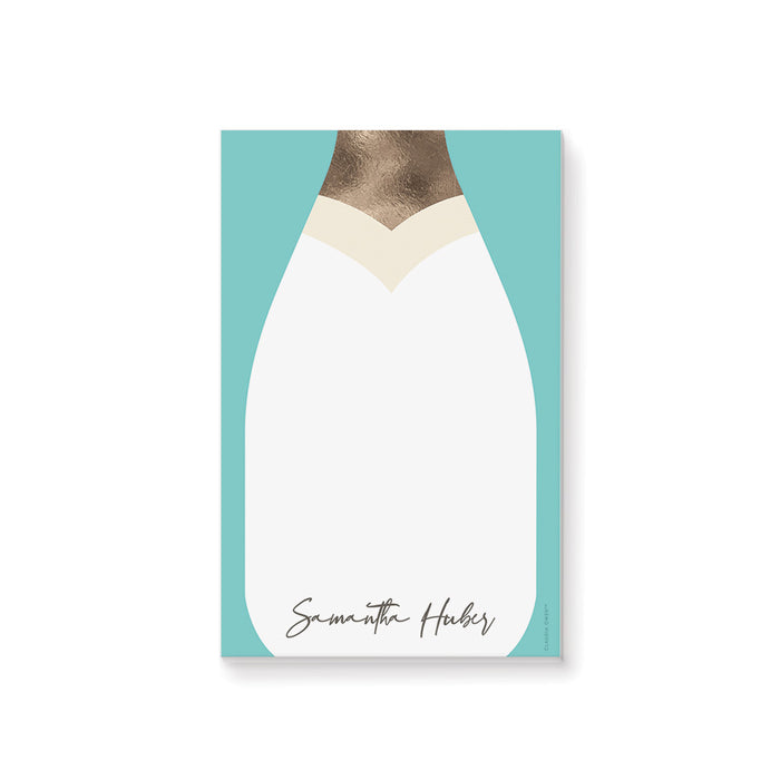 Personalized notepad with a champagne bottle illustration, perfect as a chic bridal shower gift for guests and bridesmaids.