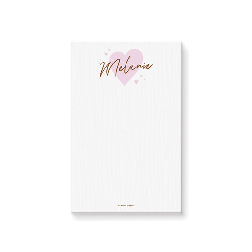 Personalized notepad featuring a light pink heart design