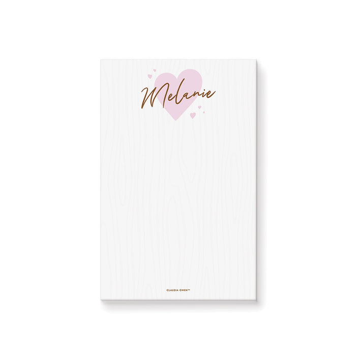 Personalized notepad featuring a light pink heart design