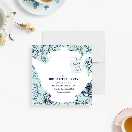 bridal shower save the date card with white teapot illustration, tea tag, floral mint background, and personalized event details-front