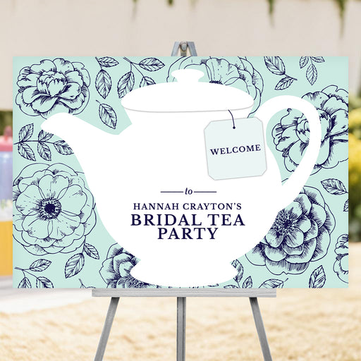 bridal shower welcome sign with large white teapot illustration, floral mint background, tea tag, and personalized bridal tea party wording
