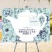 bridal shower welcome sign with large white teapot illustration, floral mint background, tea tag, and personalized bridal tea party wording
