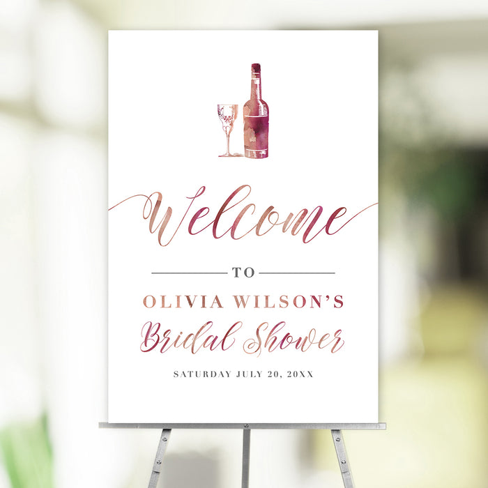 Elegant bridal shower welcome sign featuring a wine bottle and glass illustration