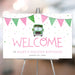Kids' birthday welcome sign featuring a green school bus illustration, pink and green bunting, and confetti, making a fun event decoration for children’s parties.