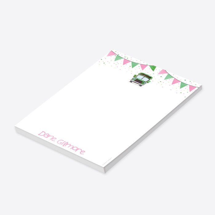 Kids notepad with a green school bus, pink and green bunting, and confetti design, perfect as a fun children’s doodle pad or stationery gift.-side