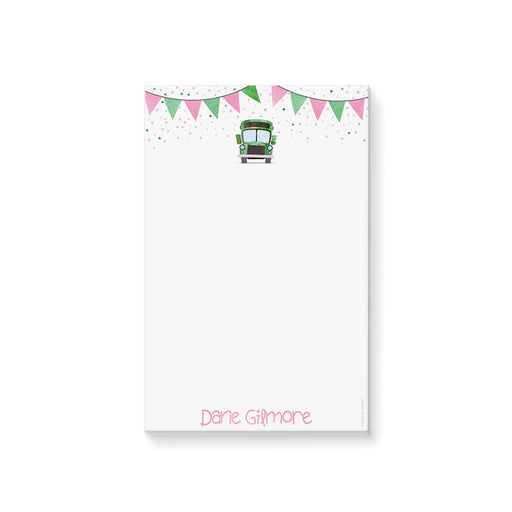 Kids notepad with a green school bus, pink and green bunting, and confetti design, perfect as a fun children’s doodle pad or stationery gift.