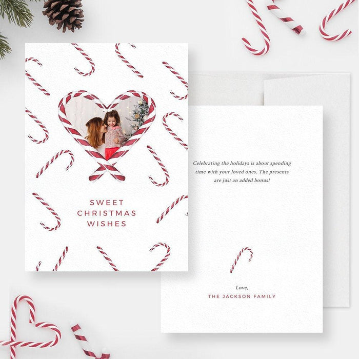a card with a picture of a couple in a heart surrounded by candy canes
