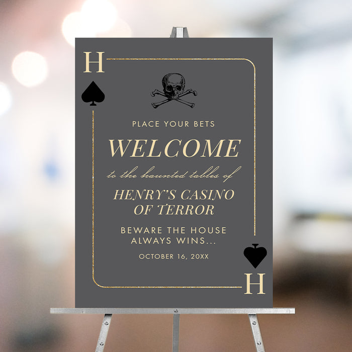 Haunted casino welcome sign featuring a playing card with skull and spade icons, casino night entrance poster.