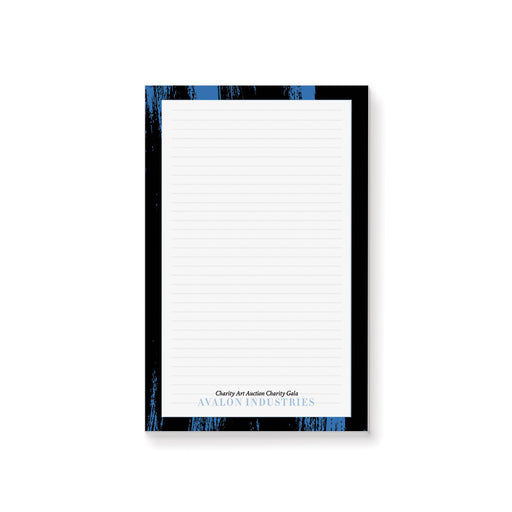 Personalized charity auction notepad with blue and black painted design for fundraising events