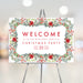 Christmas party welcome sign with poinsettias and greenery, personalized event details, perfect for holiday season.