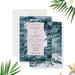Modern wedding invitation featuring a deep teal photograph of ocean waves.-front-back