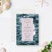Modern wedding invitation featuring a deep teal photograph of ocean waves.-front