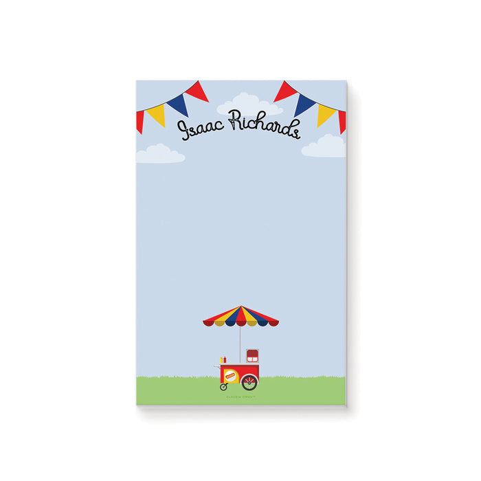 Personalized hot dog party notepad featuring a colorful food cart with striped umbrella and festive bunting.