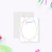 White personalized note card framed with multicolored gem outlines, beside a black back with matching geometric lines.