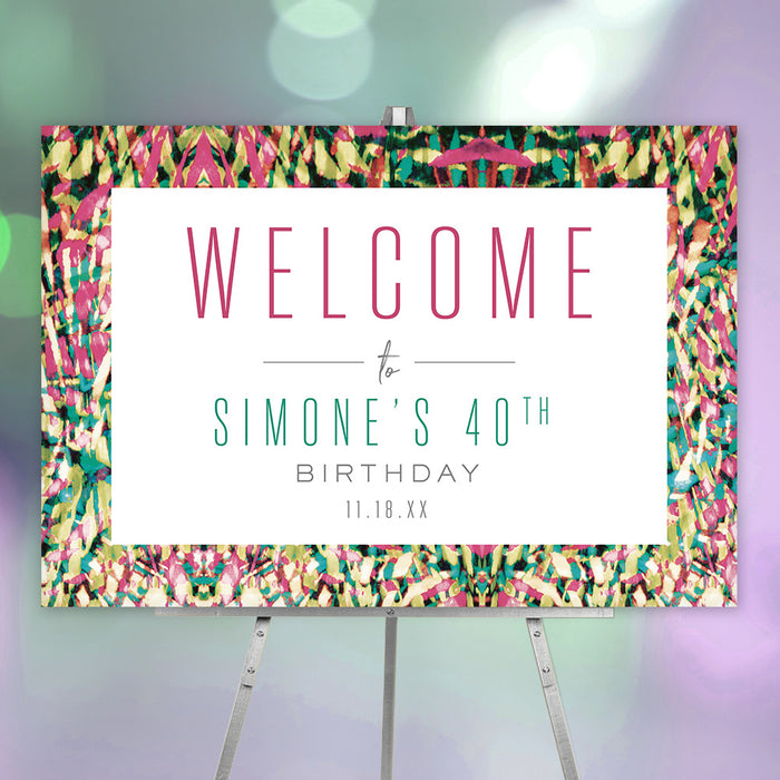 colorful tropical birthday welcome sign displayed on an easel with bright abstract border and personalized milestone birthday details