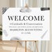 Modern abstract corporate welcome sign for cocktails and conversation event displayed on easel.