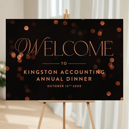 corporate annual dinner welcome sign with elegant lettering on a black background and warm confetti accents for a business event