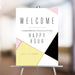 modern corporate happy hour welcome sign with geometric pink yellow black and white design for a business event