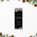 corporate winter gala ticket invitation with black background, gray botanical foliage, elegant script lettering, and admit one panel