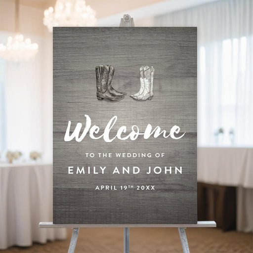 Rustic wedding welcome sign with cowboy boots, personalized with the couple's names and wedding date.