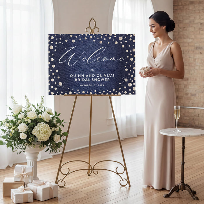 denim and pearls bridal shower welcome sign with dark blue denim-inspired background, pearl accents, and custom event details displayed on an easel