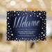 Denim and pearls welcome sign template with white script on a navy pearl patterned background.