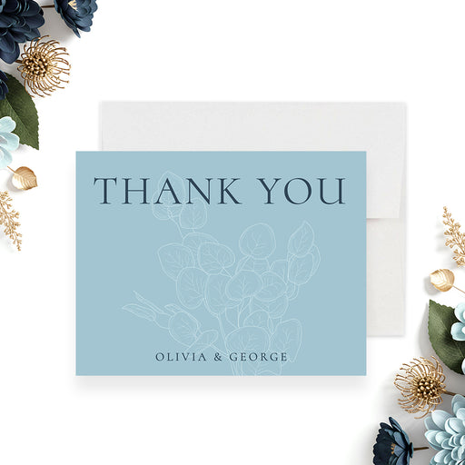 personalized blue botanical wedding thank you card with elegant thank you lettering, line art floral details, and custom couple names-front