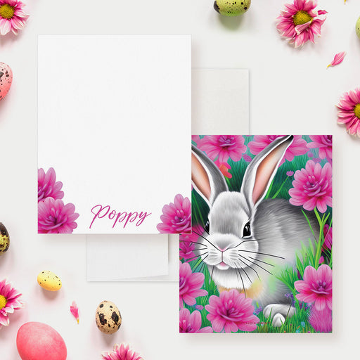 Personalized Easter note card featuring a gray bunny surrounded by bright pink flowers, perfect for spring greetings or Easter gift sets.