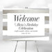 Elegant birthday welcome sign with modern striped accents and personalized celebration text on a stylish party display board.