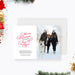 Elegant Christmas photo card template featuring white background, red script Merry Christmas and a Happy New Year greeting, family winter photo and modern minimalist layout