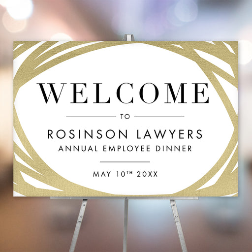 Elegant welcome sign with a gold border design, personalized with company details, displayed on an easel for an employee dinner. 