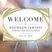 Elegant welcome sign with a gold border design, personalized with company details, displayed on an easel for an employee dinner. 