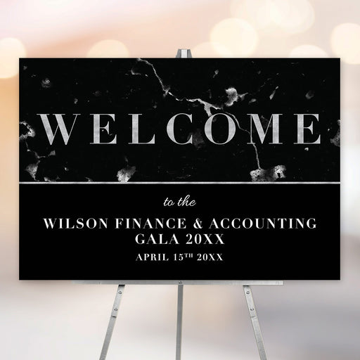 Elegant black marble welcome sign, customized with event name and date, ideal for galas and corporate events.