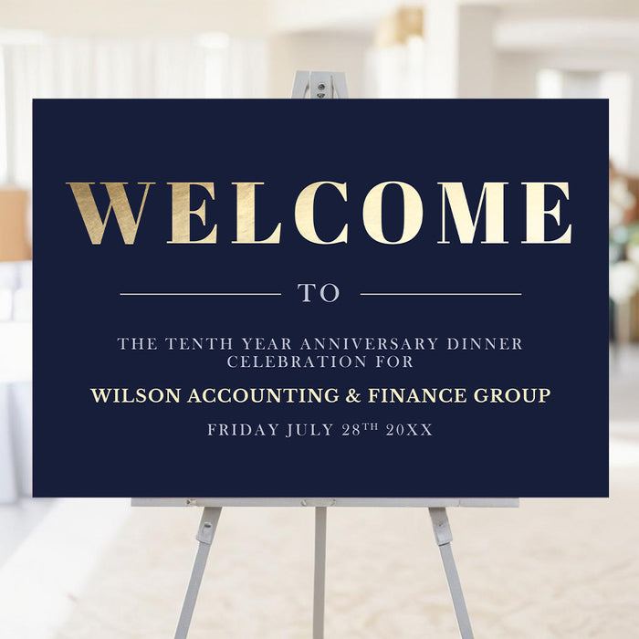 corporate anniversary welcome sign with navy background, gold-colored welcome lettering, and personalized business event details displayed on an easel