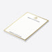 Elegant corporate holiday notepad with a festive bell design and a personalized Christmas office stationery layout-side