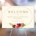 Elegant vintage floral wedding welcome sign featuring pink and peach flowers, a gold border, and personalized text for weddings or special events.