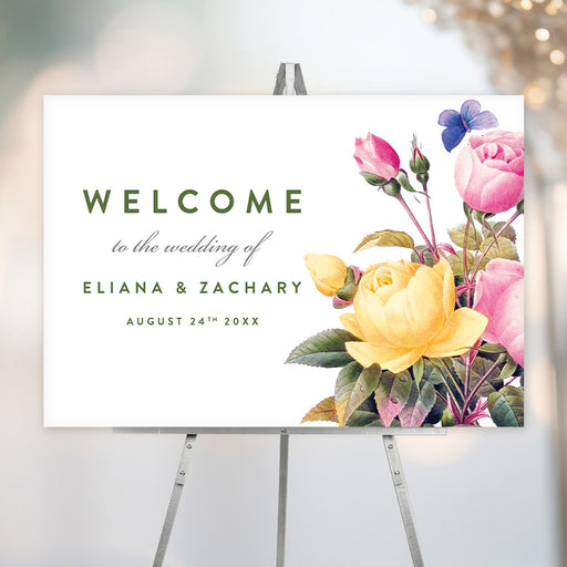 Floral wedding welcome sign with yellow and pink roses and butterflies, personalized with the couple's names and wedding date.