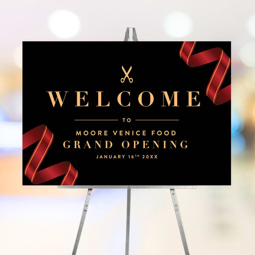 Elegant grand opening welcome sign with red ribbon design on black background, perfect for ribbon cutting ceremonies and business launch events.