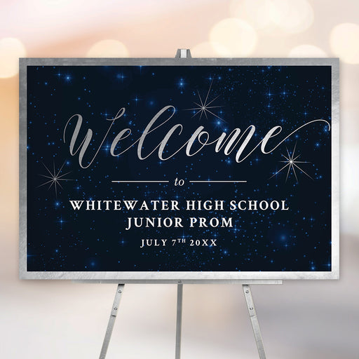 Starry night prom welcome sign with navy galaxy background and silver script for school dance event.