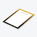 Personalized notepad with black border, sparkling light accents, and custom name in elegant script-side